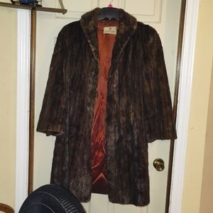 A medium brown mink coat, size s-m, brand Richland Furs Blissfield, Michigan